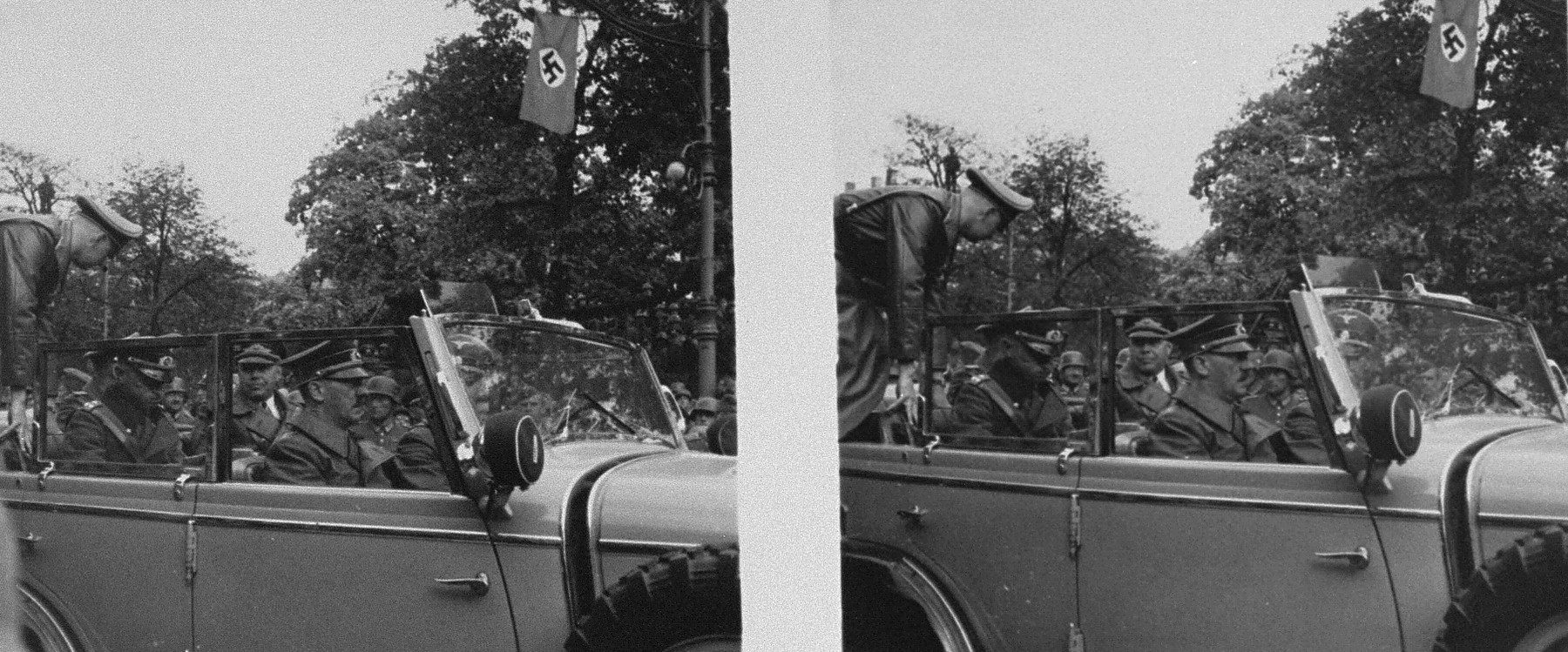 Stereoscopic photograph of Adolf Hitler and other officials leaving the viewing stand following a victory parade in Warsaw celebrating the German conquest of Poland
